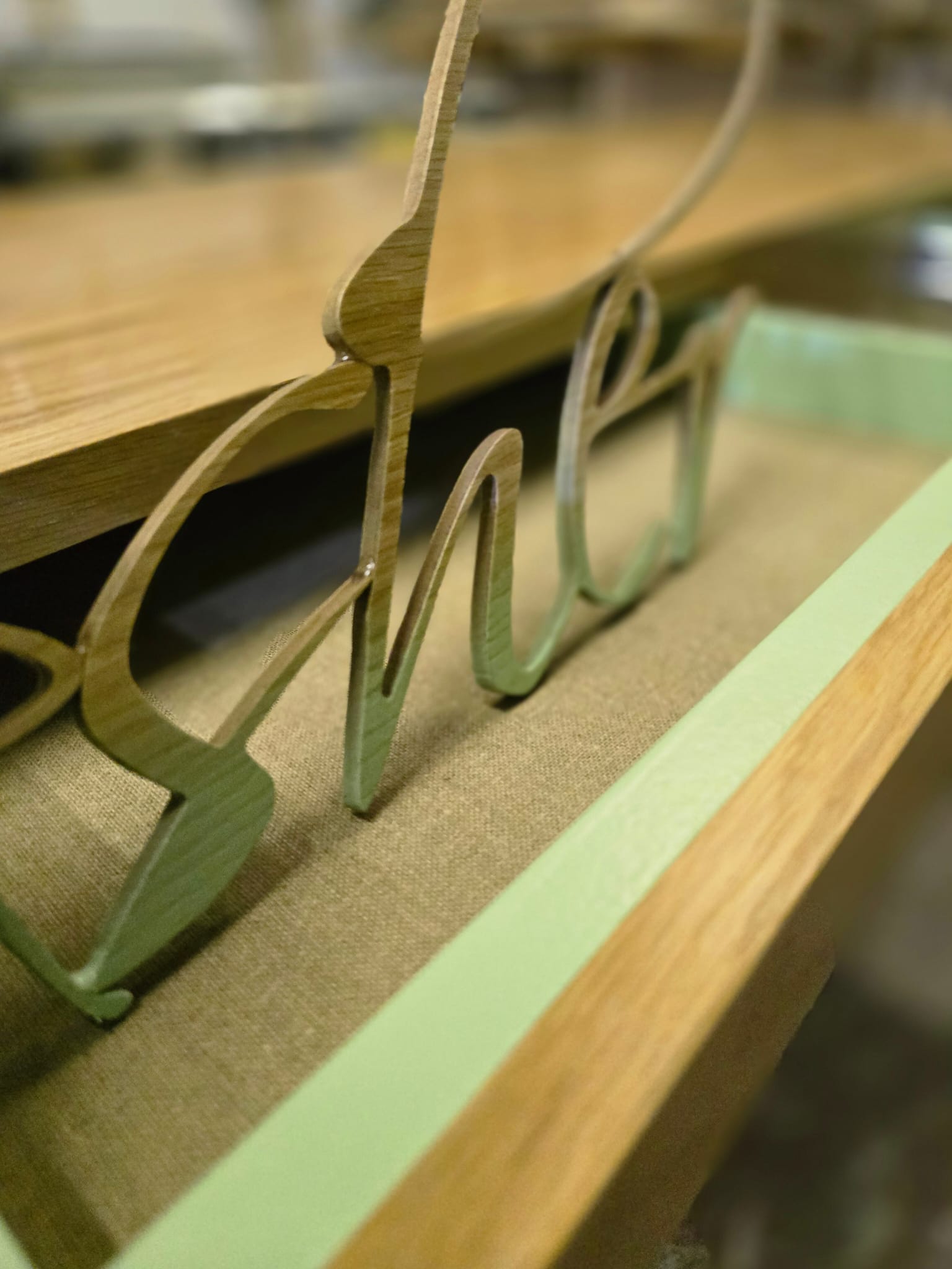 Pull-out desk trays with oak veneer and recessed handles in a Greenwich kids bedroom