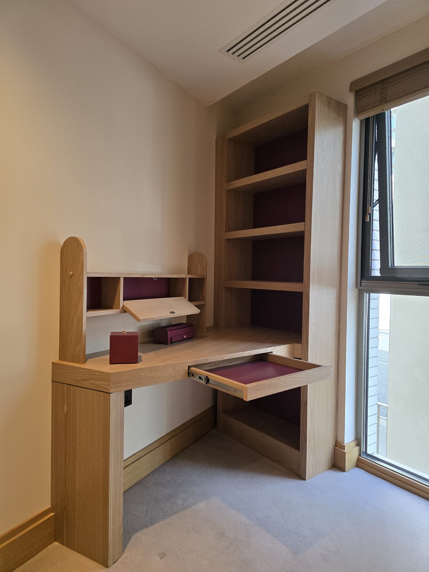 Fitted oak desk with open pull-out drawer and drop-front storage compartment in Westminster