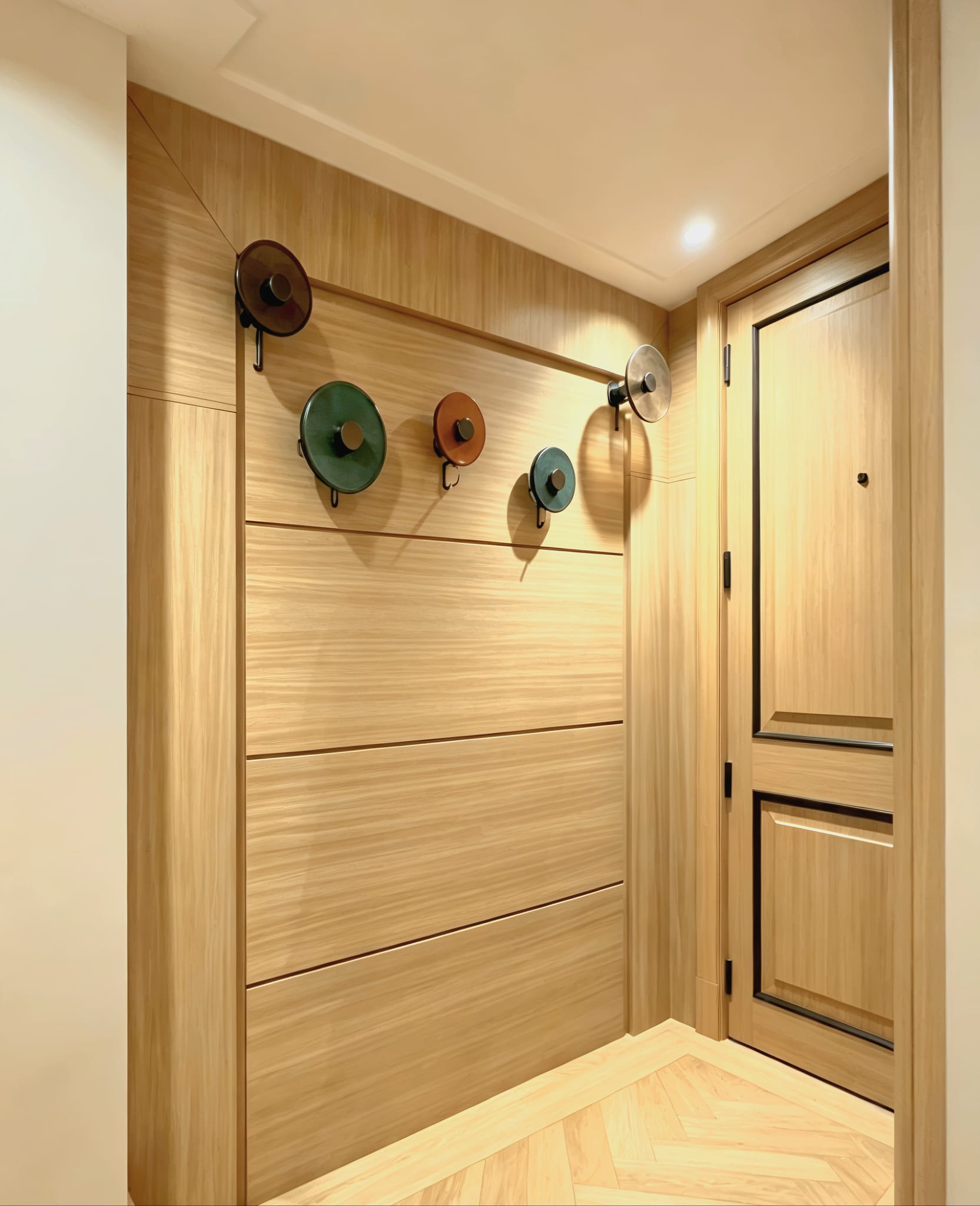 Full-height natural oak wall panelling and matching door in a Westminster flat