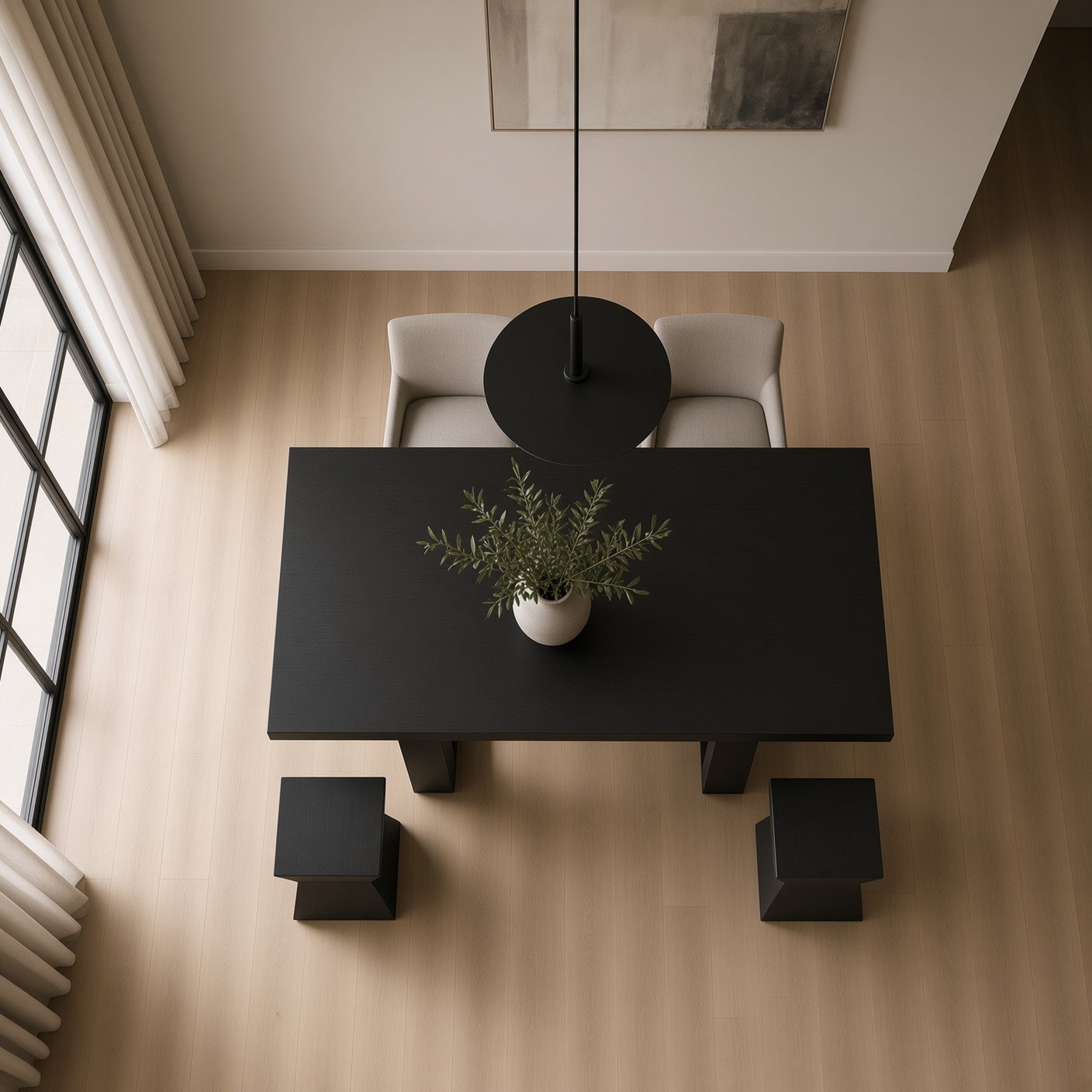 Overhead view of a dark oak table and stool set in an open-plan room