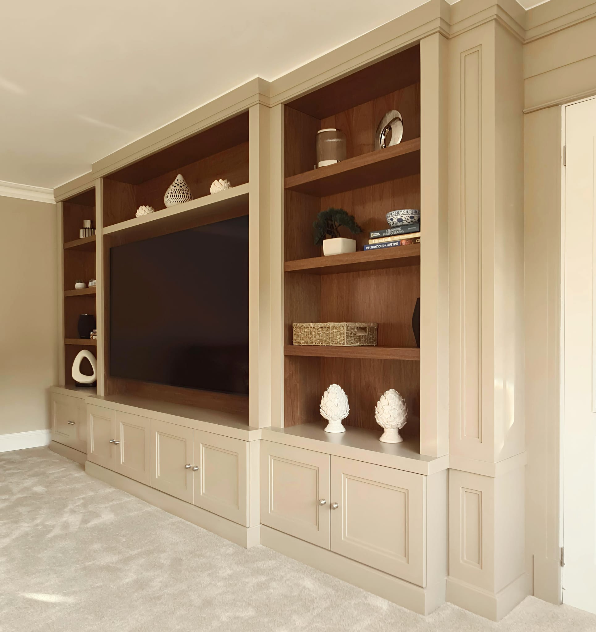 Painted media wall with American walnut back panels and shelving in Brentwood