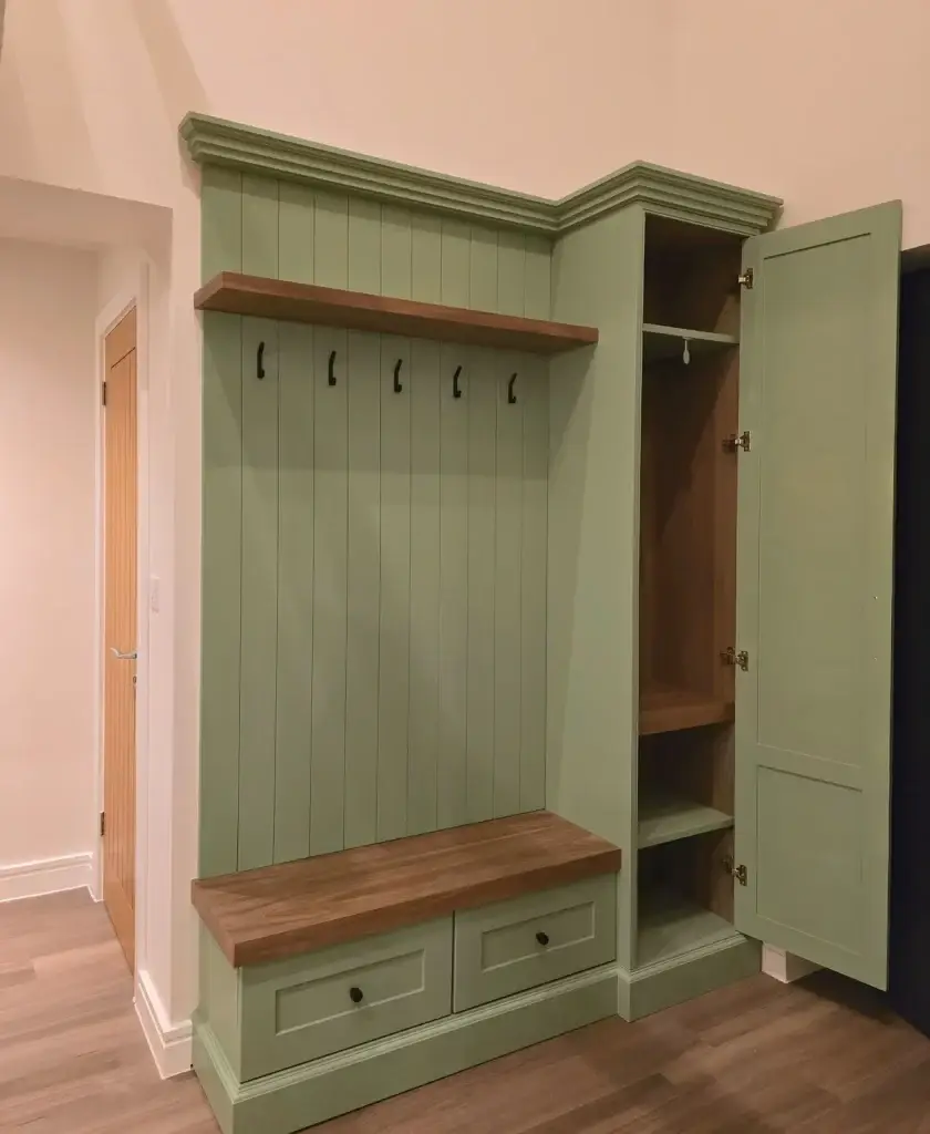 Detail of a painted hallway bench with shoe storage below