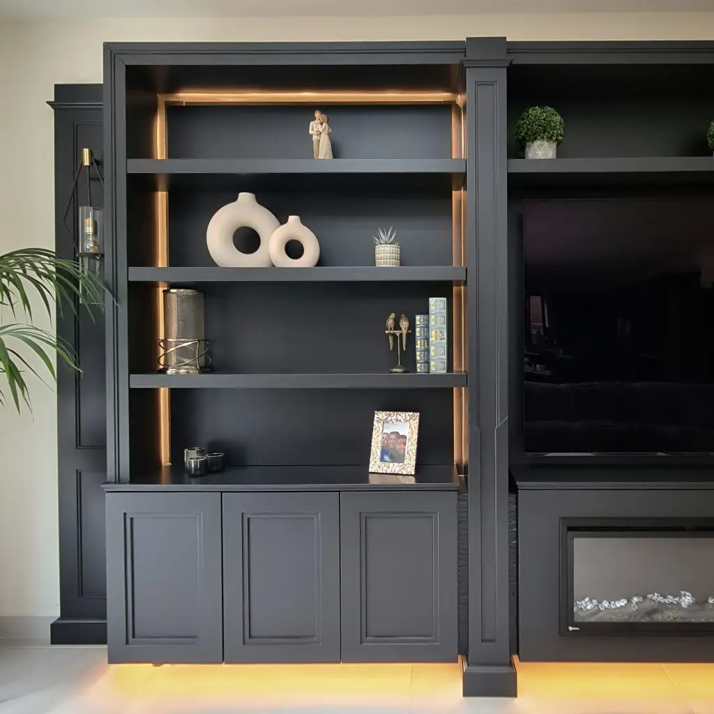 Backlit open shelves within an anthracite fitted media wall