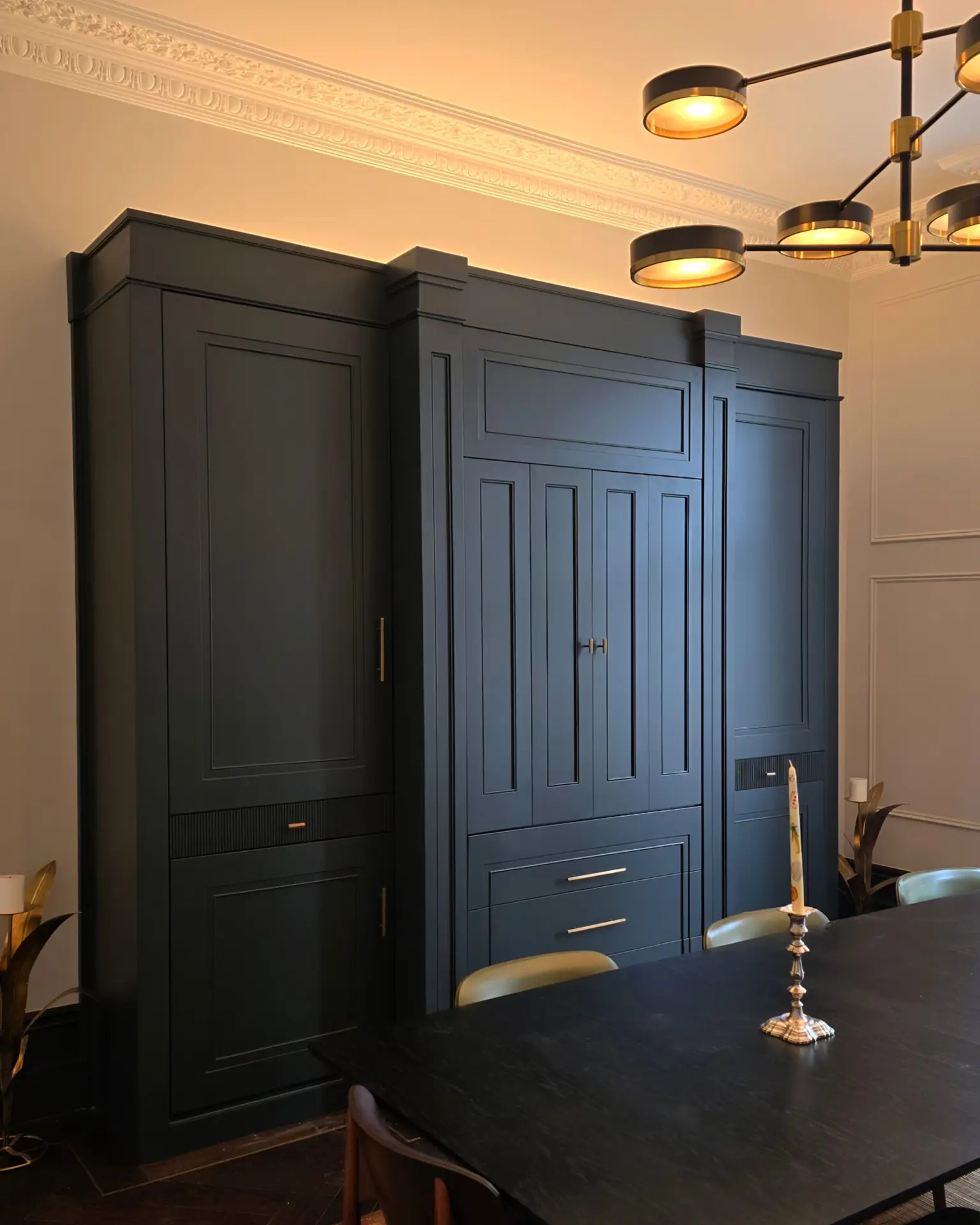 Deep blue dining-room wall joinery in Holland Park, London