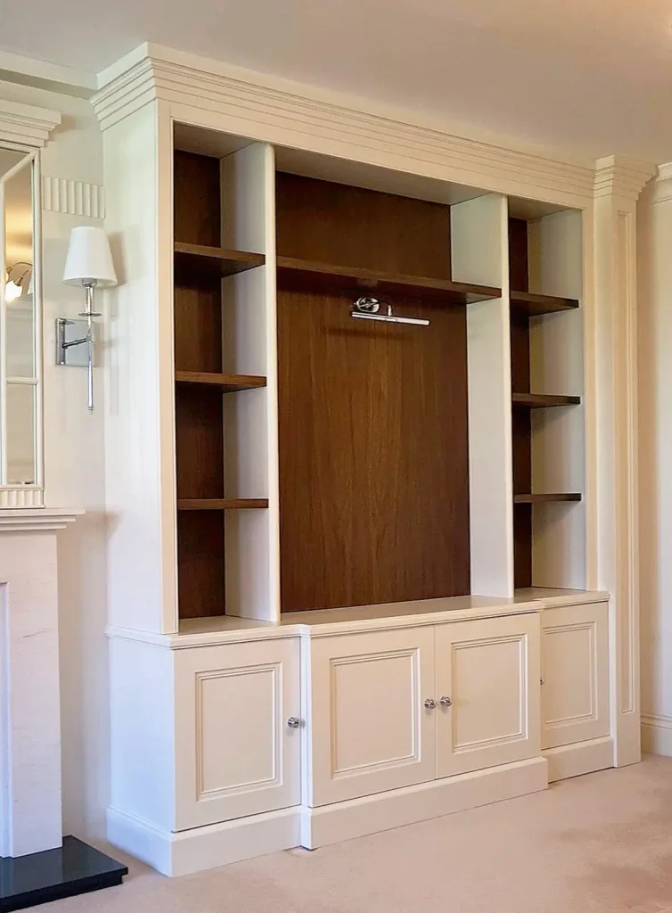 Floor-to-ceiling bespoke media unit and illuminated shelving in Ruislip, London