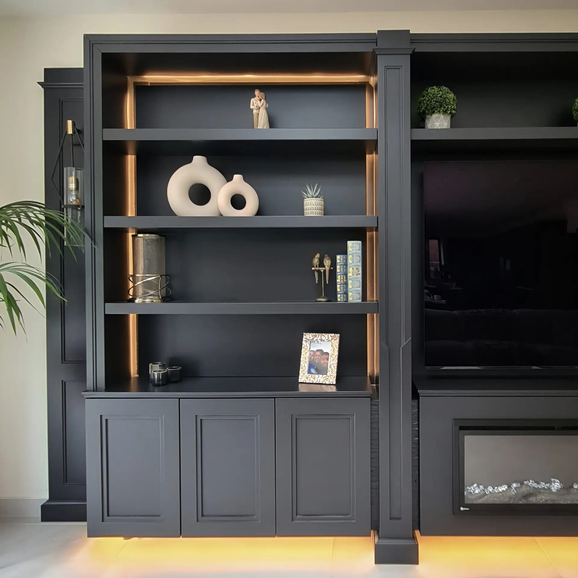 Illuminated open shelving within the Rickmansworth media wall