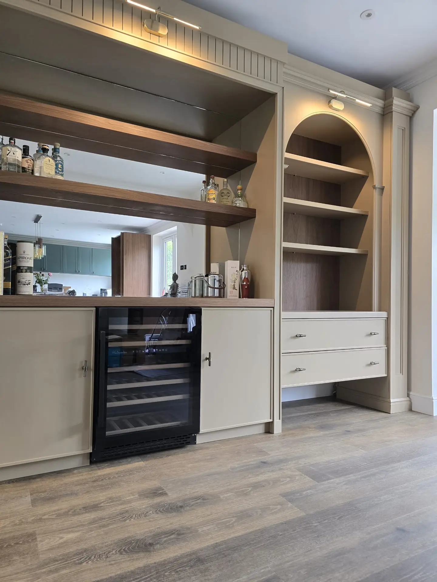 Living-room drinks cabinet and display joinery crafted for a Harrow home