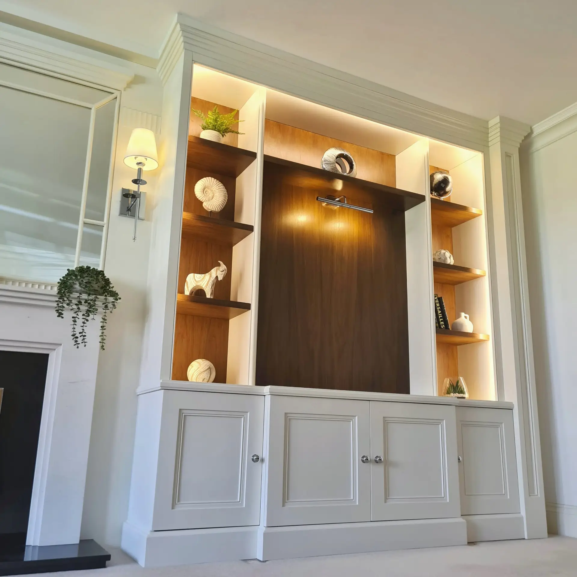 Detailed cornice and fitted cabinetry on a classical bespoke media wall
