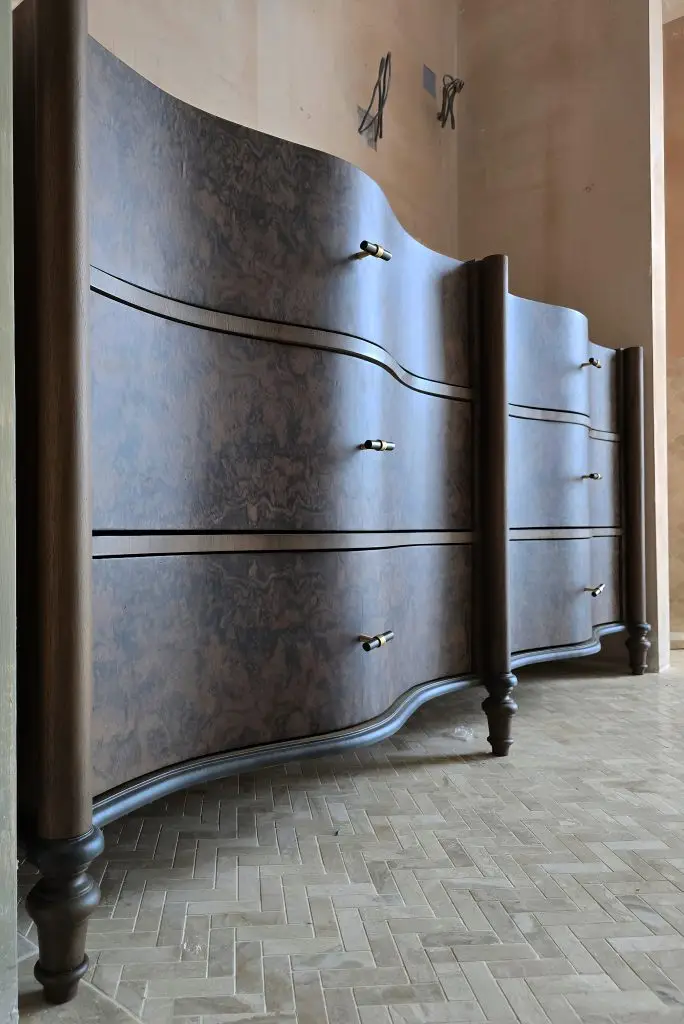 Handcrafted burr walnut double vanity with curved drawers and hand-turned legs