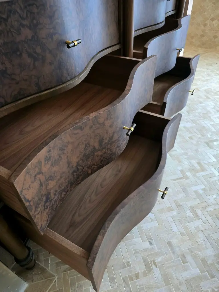 Detail of carved burr walnut vanity unit edge and veneer, Kent