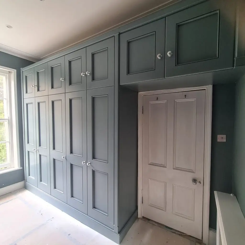 Classic Shaker-style fitted wardrobes floor-to-cornice with panelled doors, Islington, London