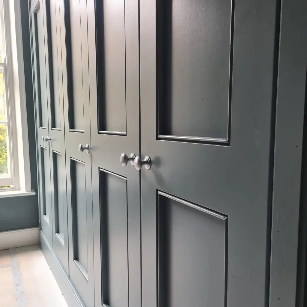 Detail of Shaker-style fitted wardrobe hardware and panel, Islington, London