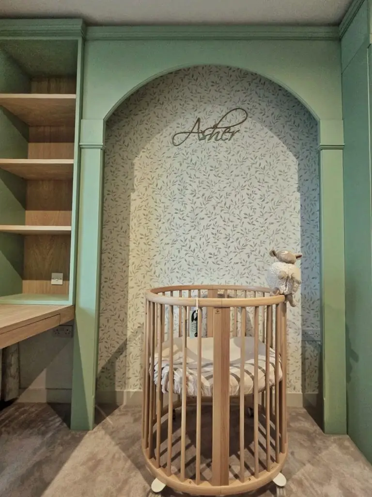 Bespoke sage green nursery — arched feature niche with custom Asher name detail